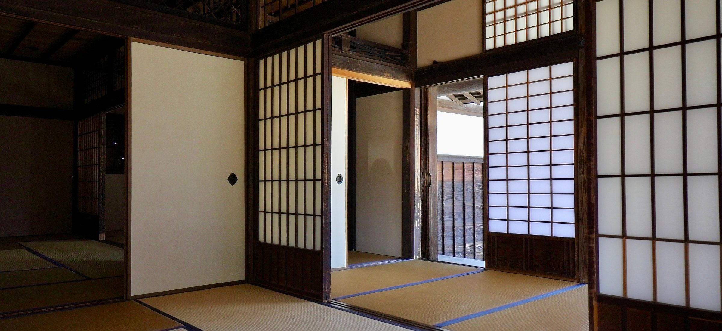 A tatami room in an old Japanese house, light through paper screens